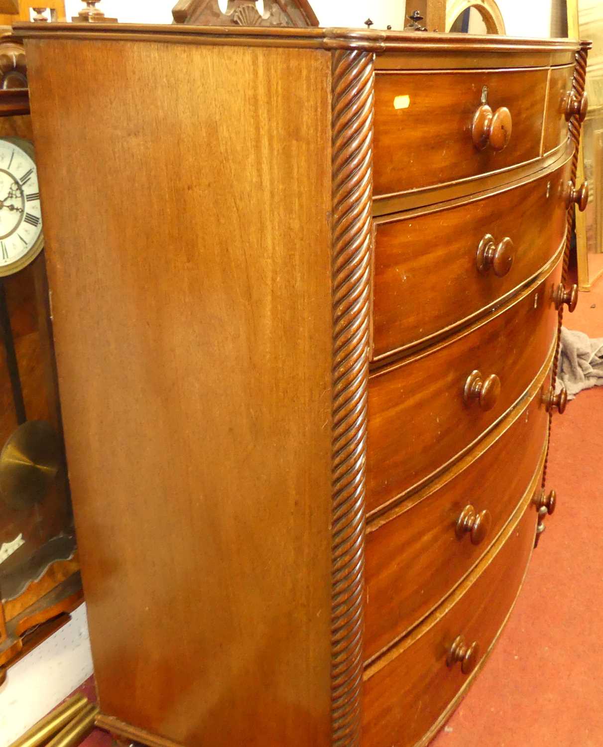 A Regency mahogany bowfront chest, of two short over four long graduated drawers within spiral - Image 2 of 4