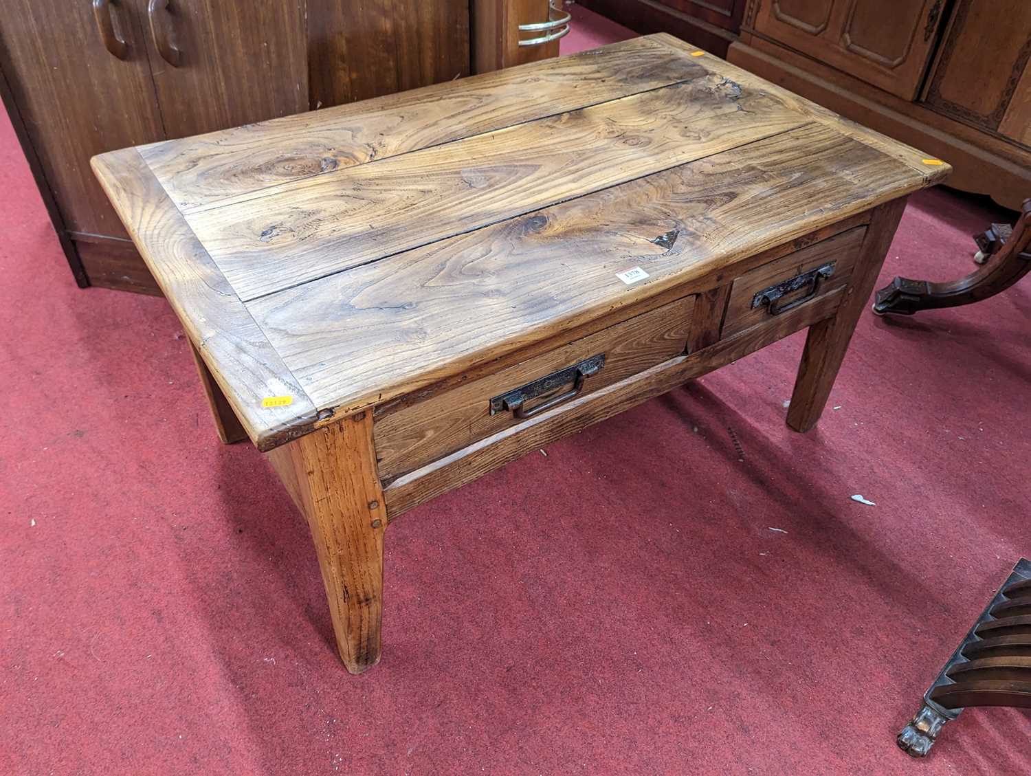 A contemporary elm plank topped rectangular low occasional table, having twin frieze drawers, length