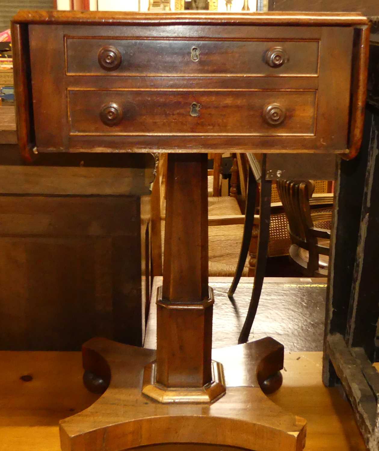 A George IV mahogany dropflap two drawer work table, raised on quatraform base, w.42cm