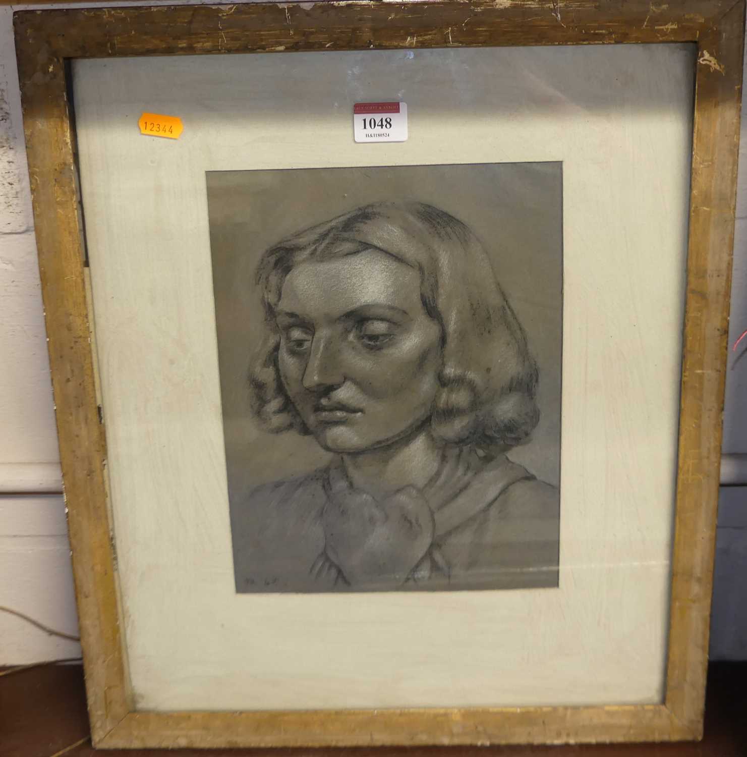 Early 20th century school- Bust portrait of a young woman, black & white chalks, signed with