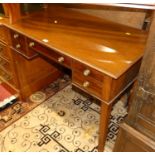 A circa 1900 mahogany kneehole dressing table, having an arrangement of four drawers, on square