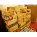 A large collection of various sized wicker travelling picnic baskets and hampers etc