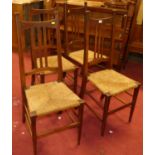 A set of four Arts & Crafts oak slat back rush seat dining chairs One chair is a little loose, but