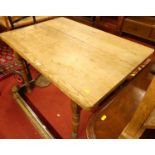 A rustic pine round cornered compact kitchen table, raised on turned supports, length 104.5cm