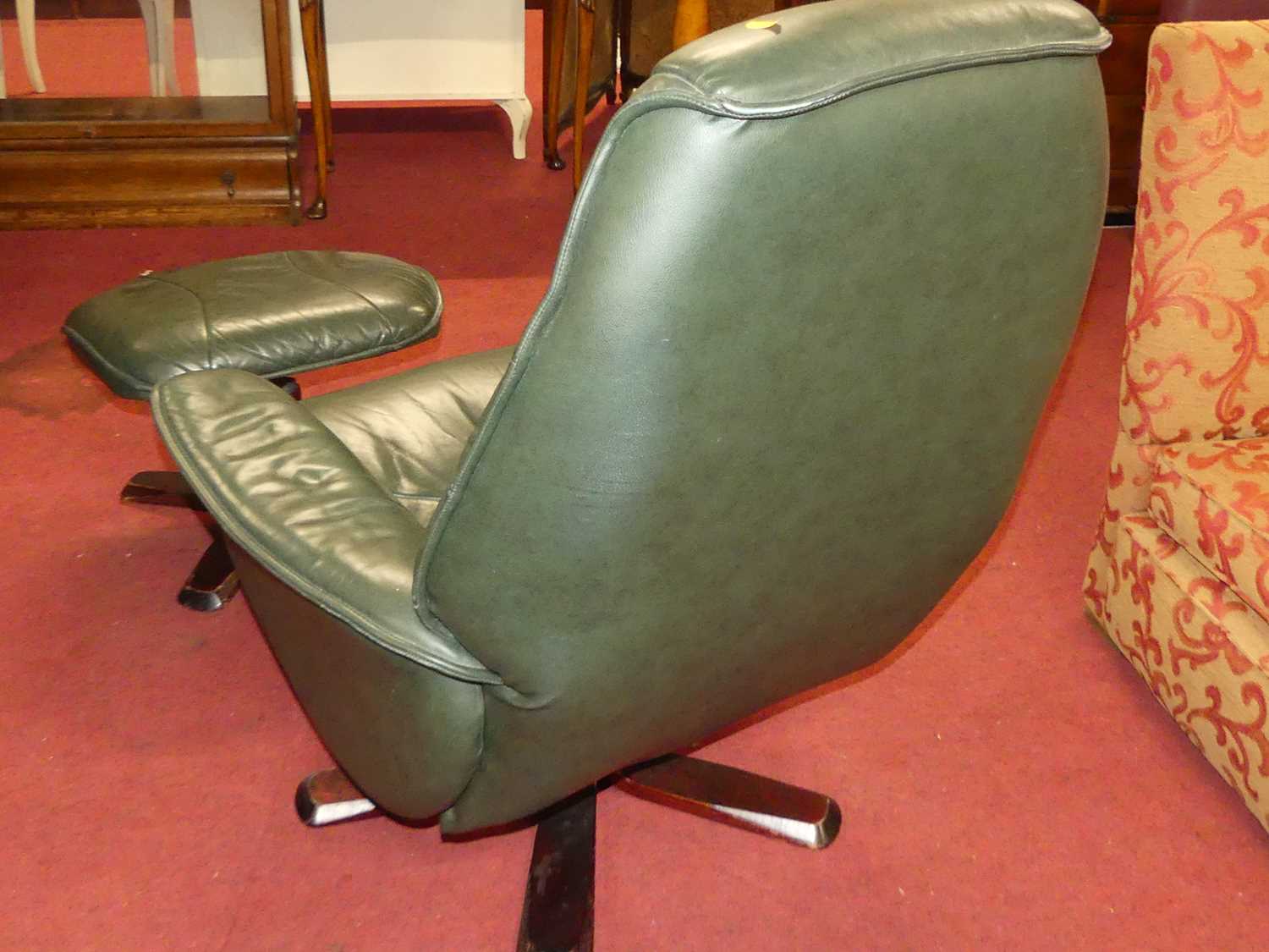 A contemporary green leather upholstered and formed laminate framed swivel armchair, with matching - Image 5 of 5