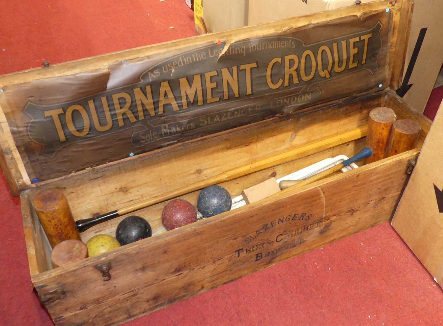A Slazenger of London croquet set, the metal bound pine box containing four mallets, four coloured