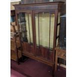 An Edwardian mahogany, flame mahogany and further satinwood inlaid double door glazed china