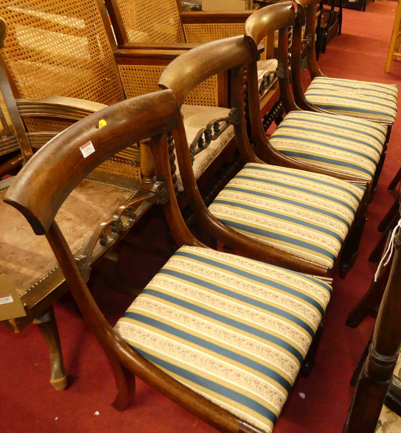 A set of four 19th century rosewood bar back dining chairs, each having striped floral upholstered