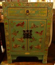 An Eastern painted and gilt decorated double door bedside cupboard, having single upper drawer,