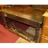 A rustic 19th century stained pine two drawer work table, on turned supports, w.117cm