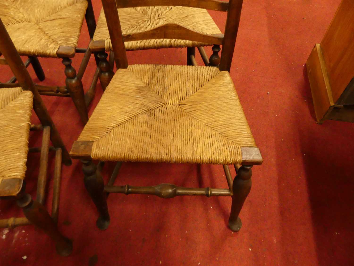 Four provincial elm and beech ladder back rush seat kitchen chairs Loose in the joints and wobbly. - Image 2 of 4