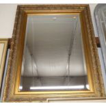 A gilt framed and bevelled rectangular wall mirror, 116x86cm