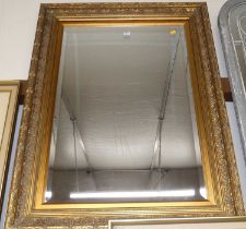 A gilt framed and bevelled rectangular wall mirror, 116x86cm