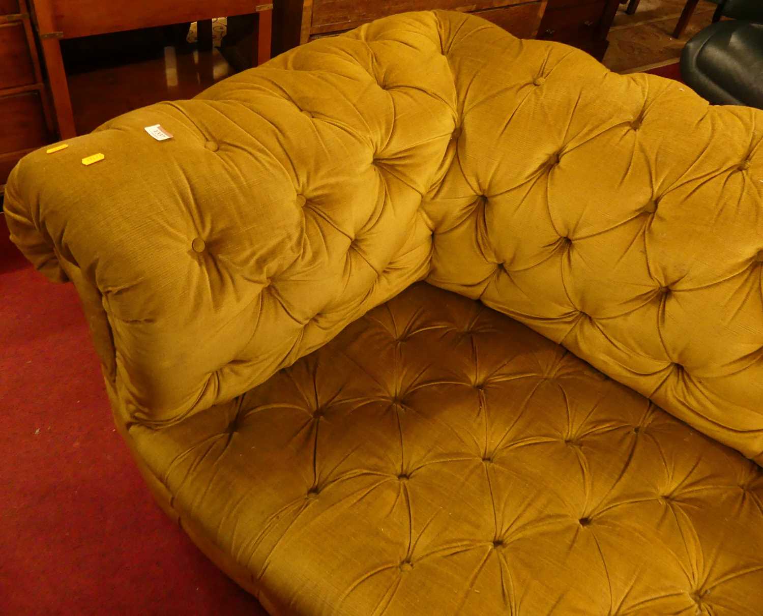 A circa 1900 and later mustard fabric button upholstered two-seater Chesterfield, raised on ring - Image 4 of 4