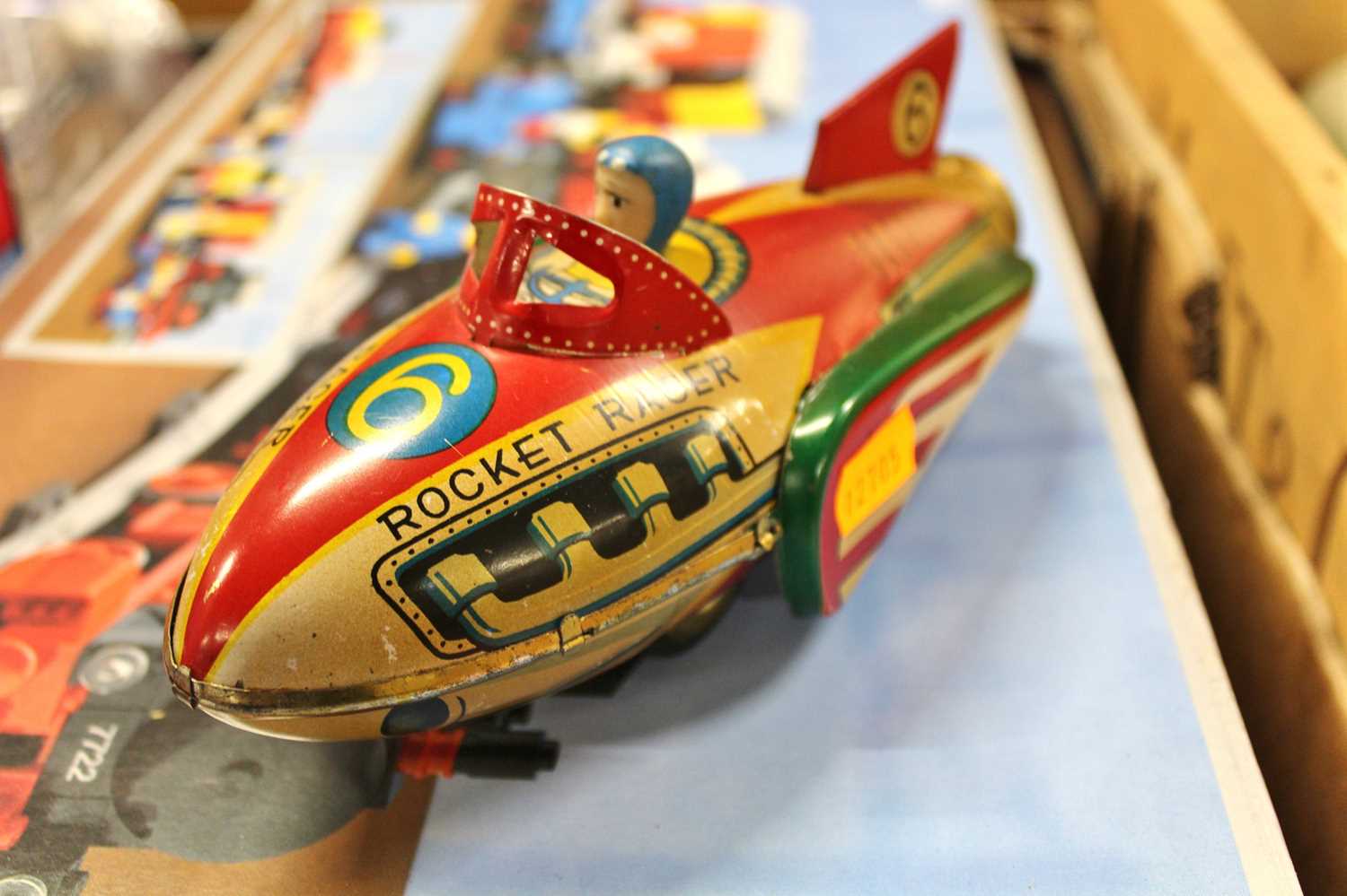 A tin plate friction drive Rocket Racer, comprising of red, yellow and green lithographed body - Image 2 of 2