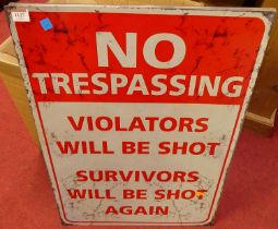 A lithograph printed tin sign 'No Trespassing', 70 x 50cm