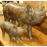 A contemporary metal model of a standing sow, length 55cm; together with a matching standing piglet,