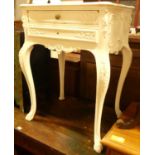 A French later white painted serpentine two drawer side table, raised on pronounced cabriole