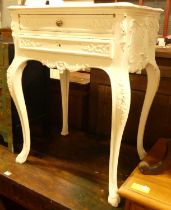 A French later white painted serpentine two drawer side table, raised on pronounced cabriole