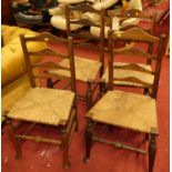 Four provincial elm and beech ladder back rush seat kitchen chairs Loose in the joints and wobbly.