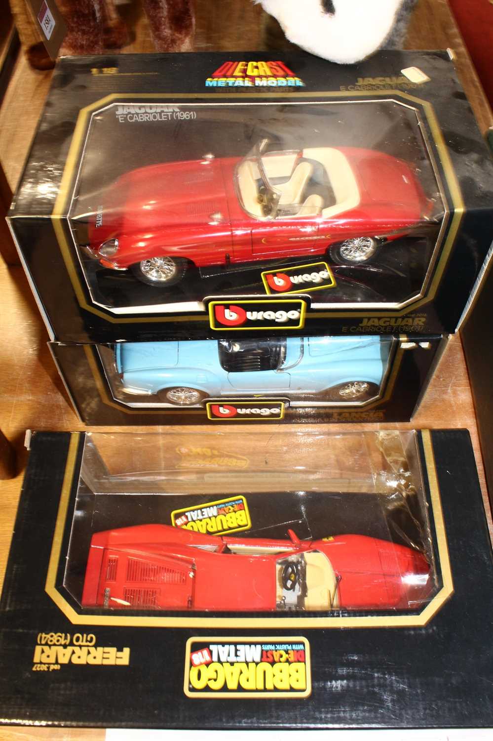 A collection of four various boxed Burago 1/18 scale diecast to include a Jaguar E cabriolet 1961 - Image 2 of 2