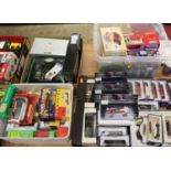 Four boxes containing a large collection of mixed commercial and racing related diecast vehicles, to