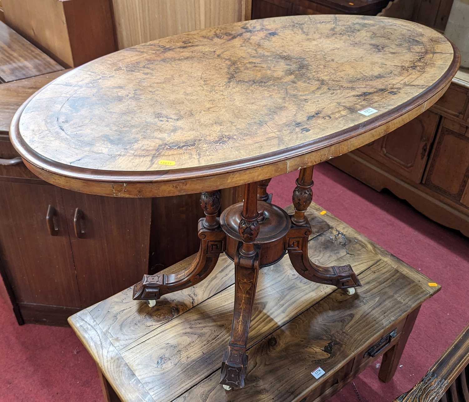 A mid-Victorian figured walnut and floral satinwood inlaid oval pedestal loo table, length 106cm