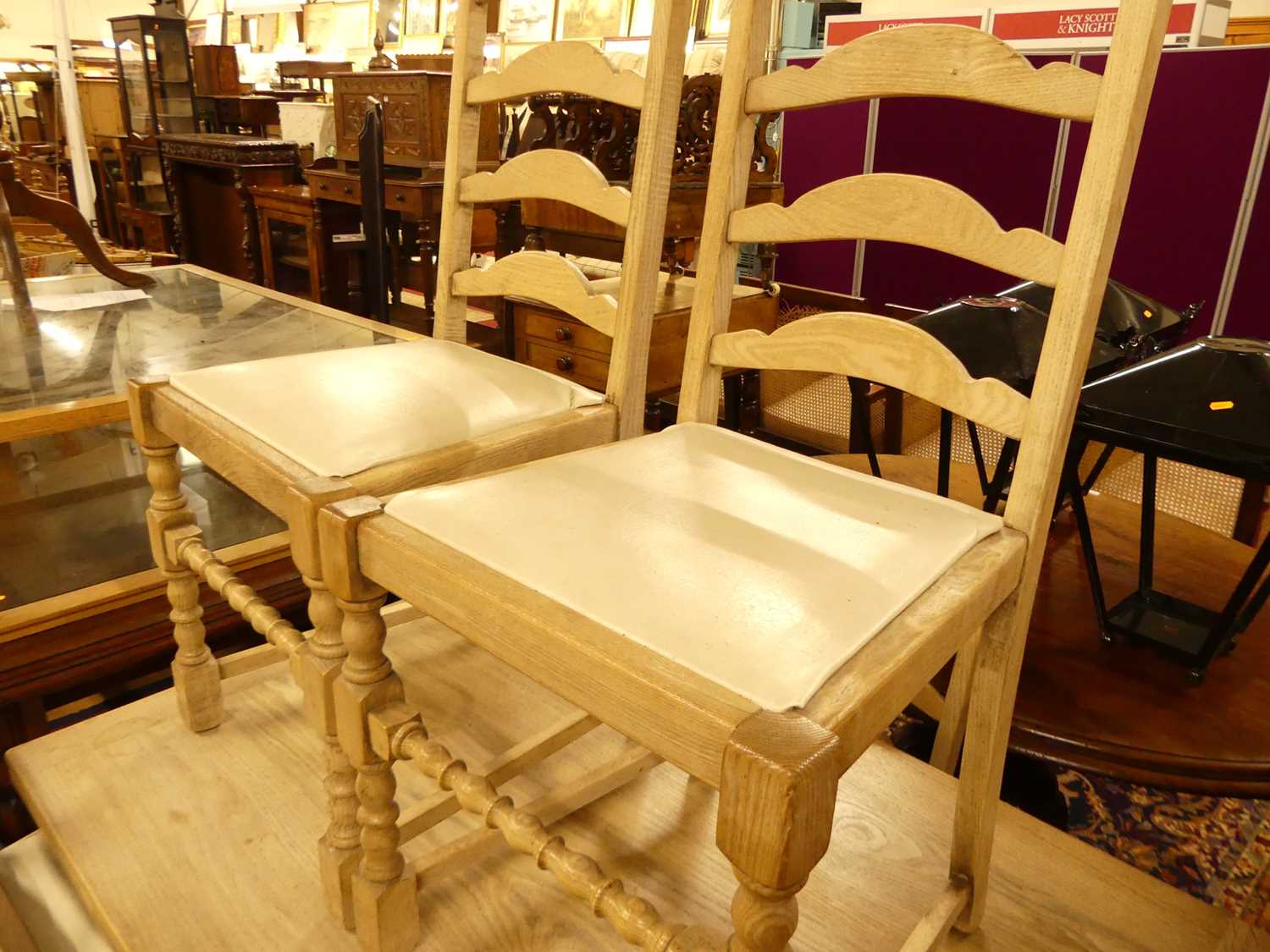 A 1930s limed oak dining suite, comprising; draw-leaf dining table, enclosed length 122cm, and a - Image 2 of 5