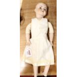 A vintage headed and jointed collectable doll marked KR117 to nape and rear of head, fixed eyes,