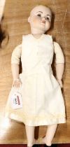 A vintage headed and jointed collectable doll marked KR117 to nape and rear of head, fixed eyes,