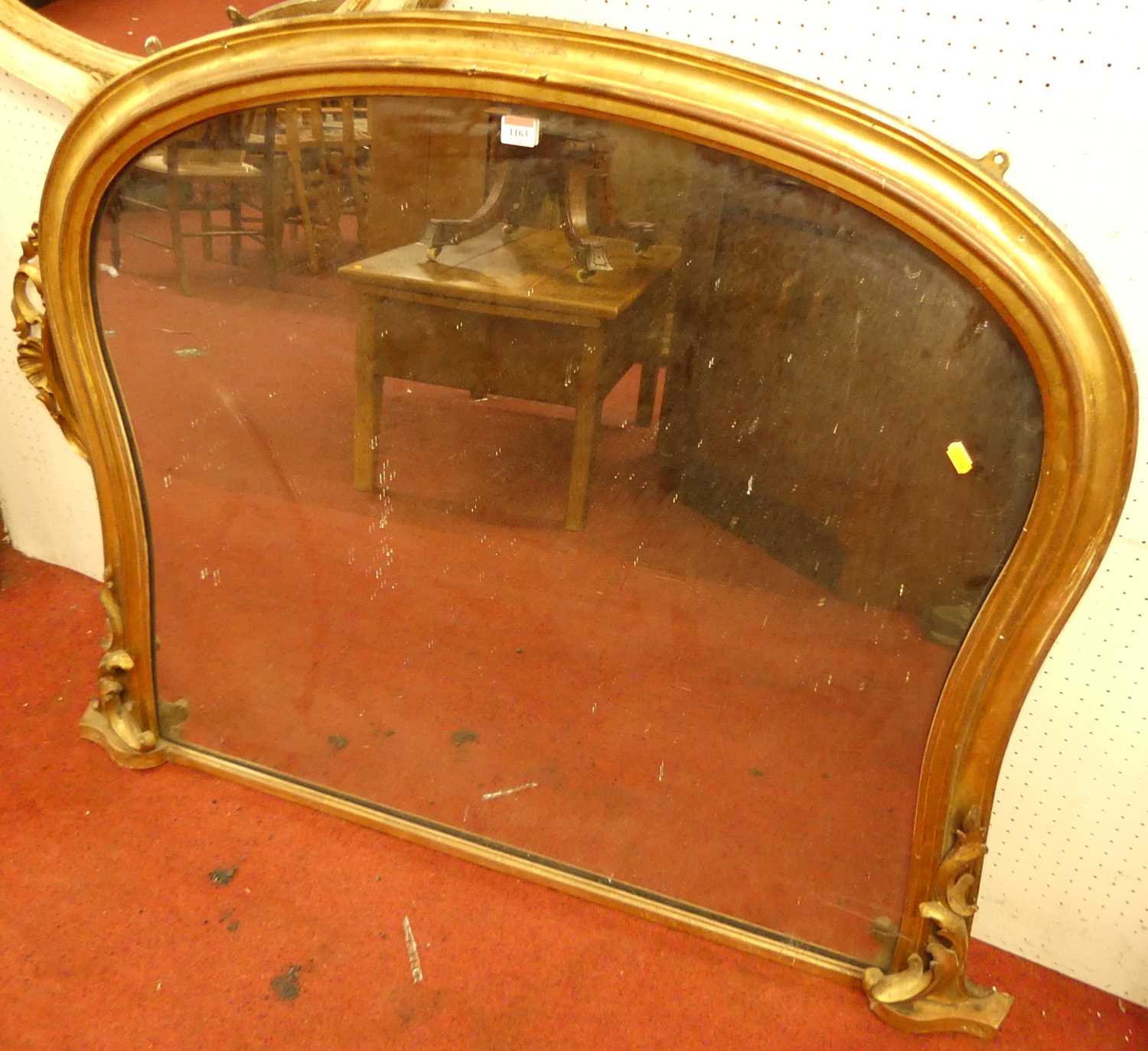 A mid-Victorian giltwood framed arched overmantel mirror, having floral lower detail, 96 x 130cm
