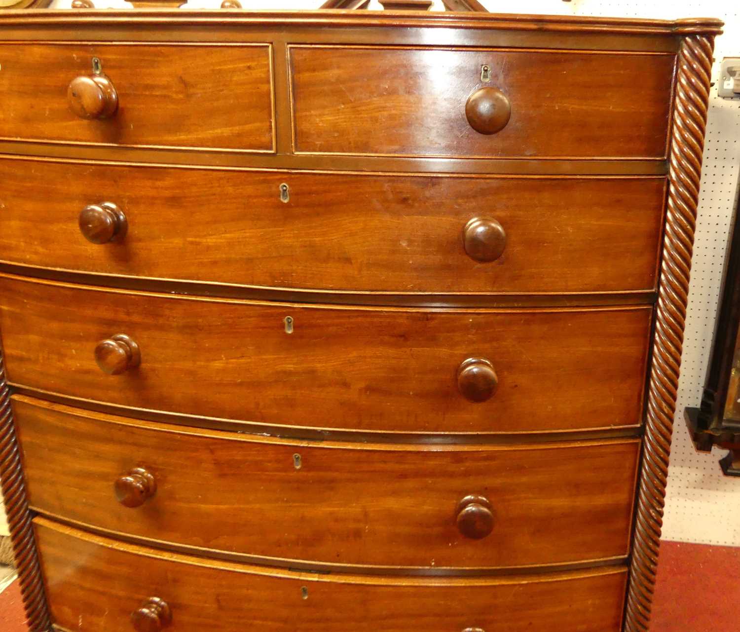 A Regency mahogany bowfront chest, of two short over four long graduated drawers within spiral - Image 3 of 4