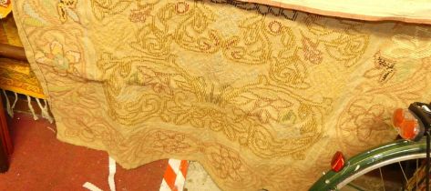 A Continental embroidered beige ground woollen wall hanging