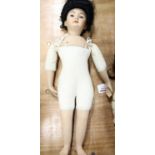 A Simon Halbig bisque headed and soft filled jointed doll, with brown eyes and marked Simon Halbig