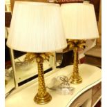 A pair of contemporary gilt table lamps, each in the form of a palm tree, with pleated silk