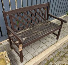 A stained teak slatted two-seater garden bench, width 121.5cm