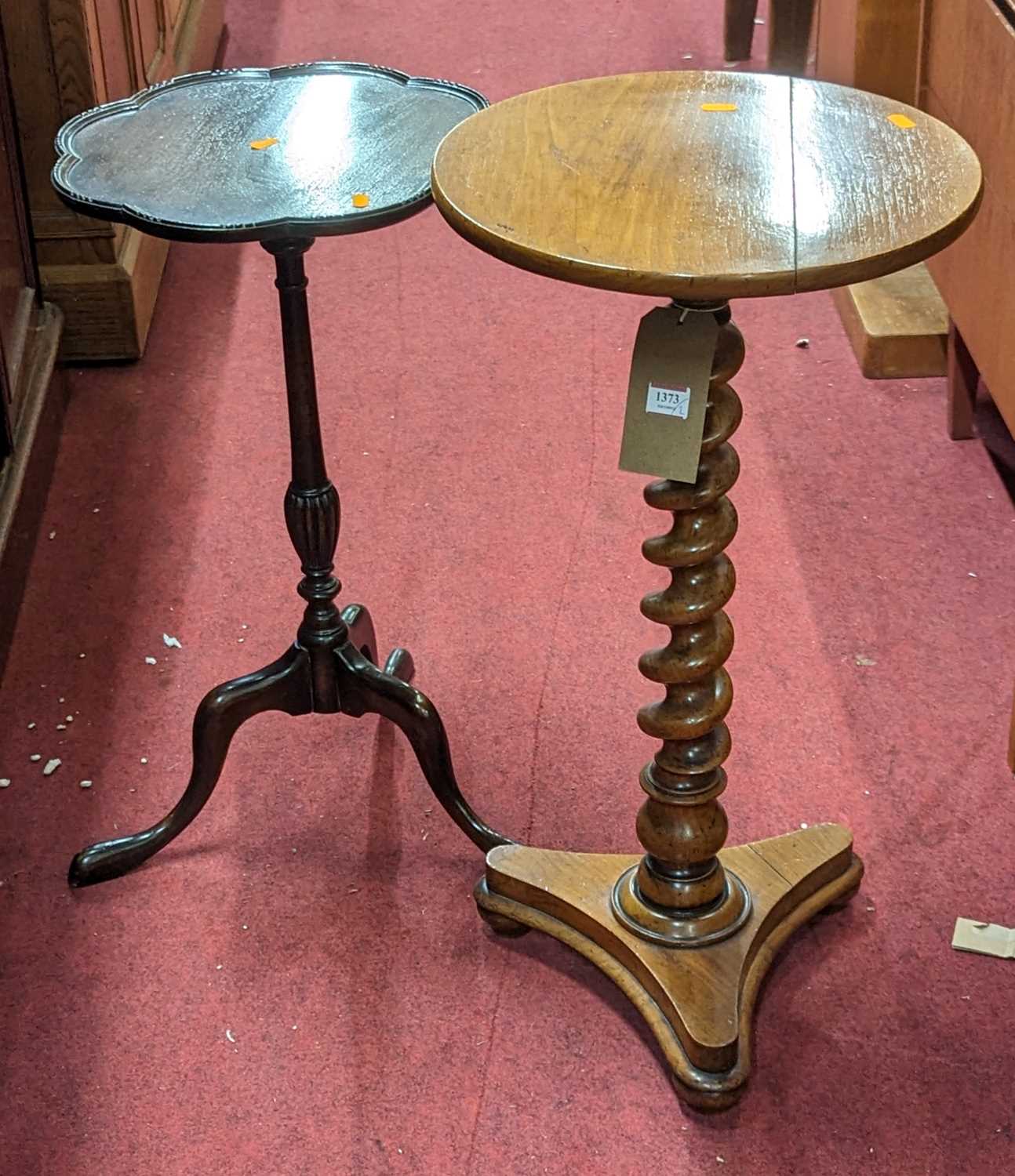 A Victorian walnut circular fixed pedestal topped tripod occasional table, raised on spiral turned