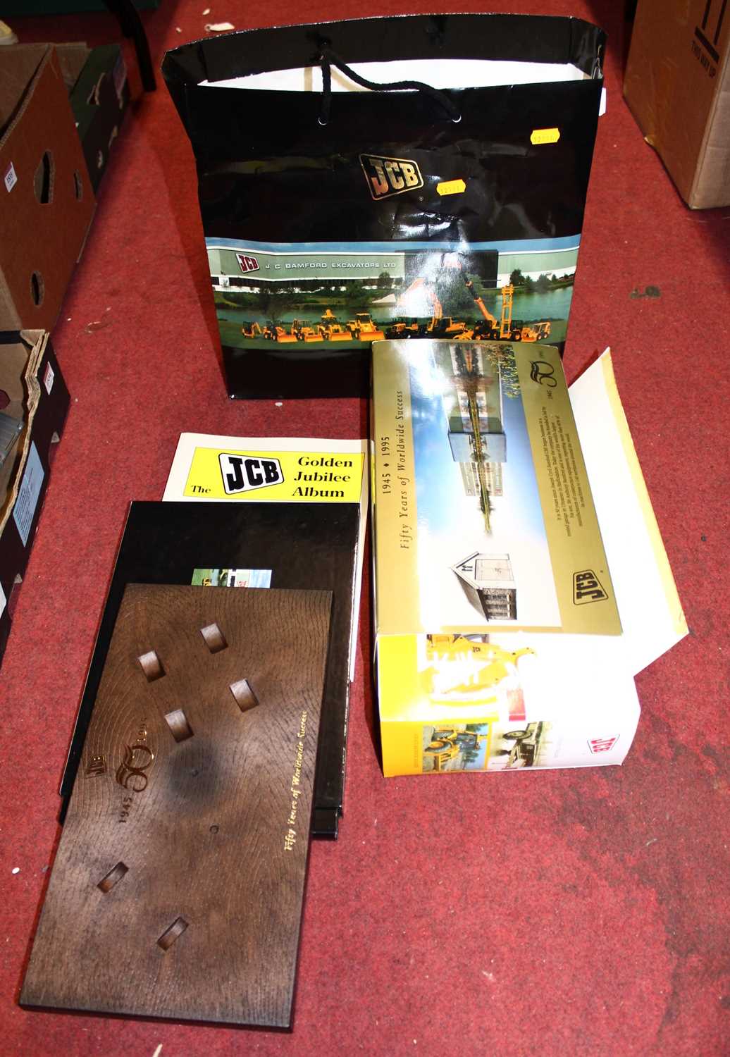 A JCB 50 years of worldwide service site master and farm trailer gift set, housed in the original