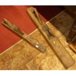 Two rustic long woodworking planes, the larger length 100cm