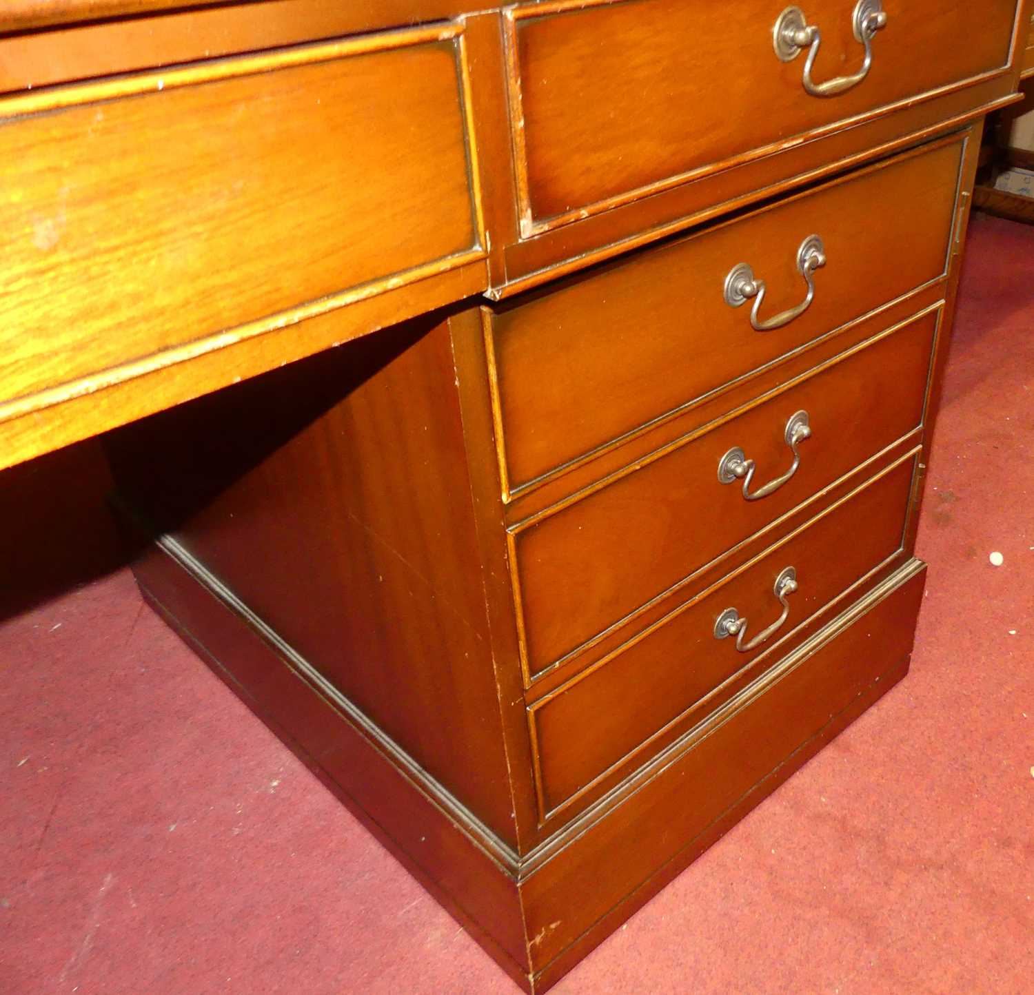 A contemporary mahogany and gilt tooled tan leather inset twin pedestal writing desk, having an - Image 2 of 2