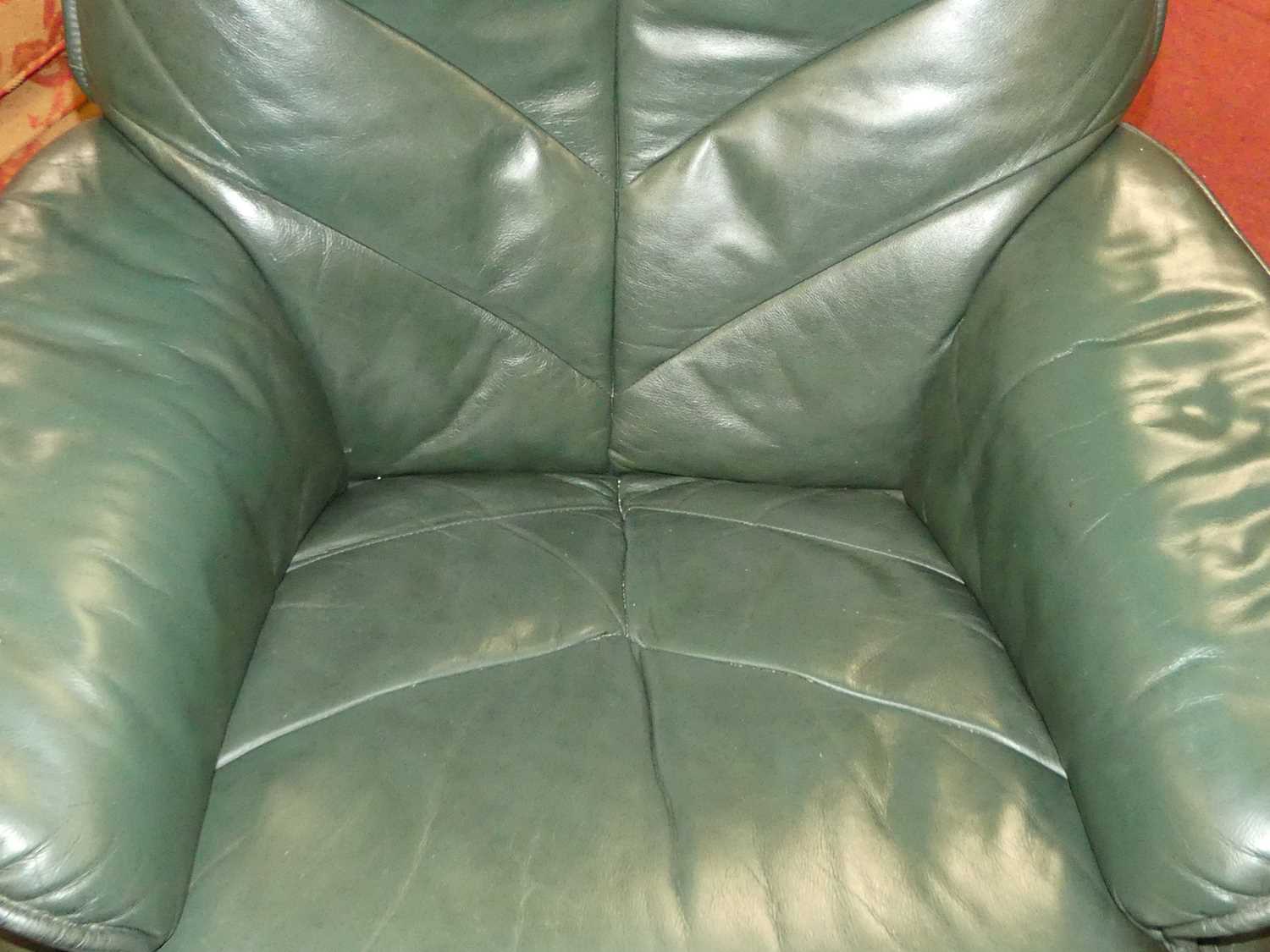 A contemporary green leather upholstered and formed laminate framed swivel armchair, with matching - Image 4 of 5