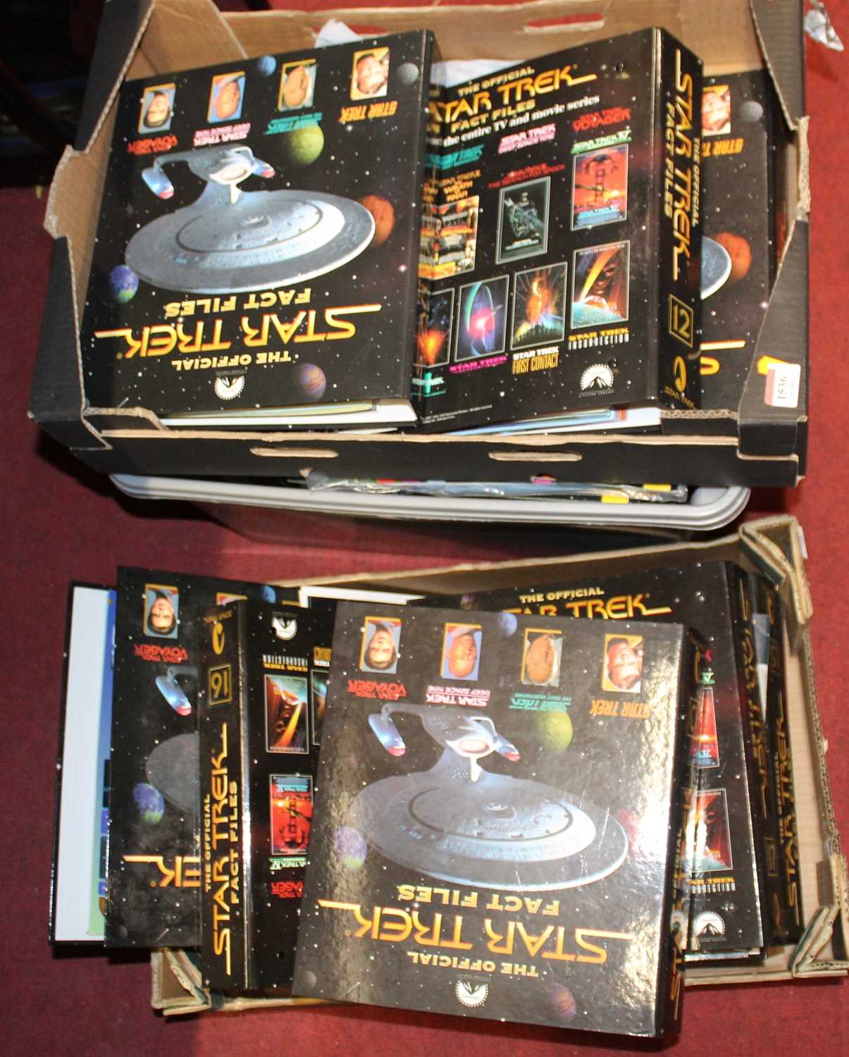 Three boxes containing a quantity of The Official Star Trek Fact Files magazines and binders