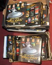 Three boxes containing a quantity of The Official Star Trek Fact Files magazines and binders