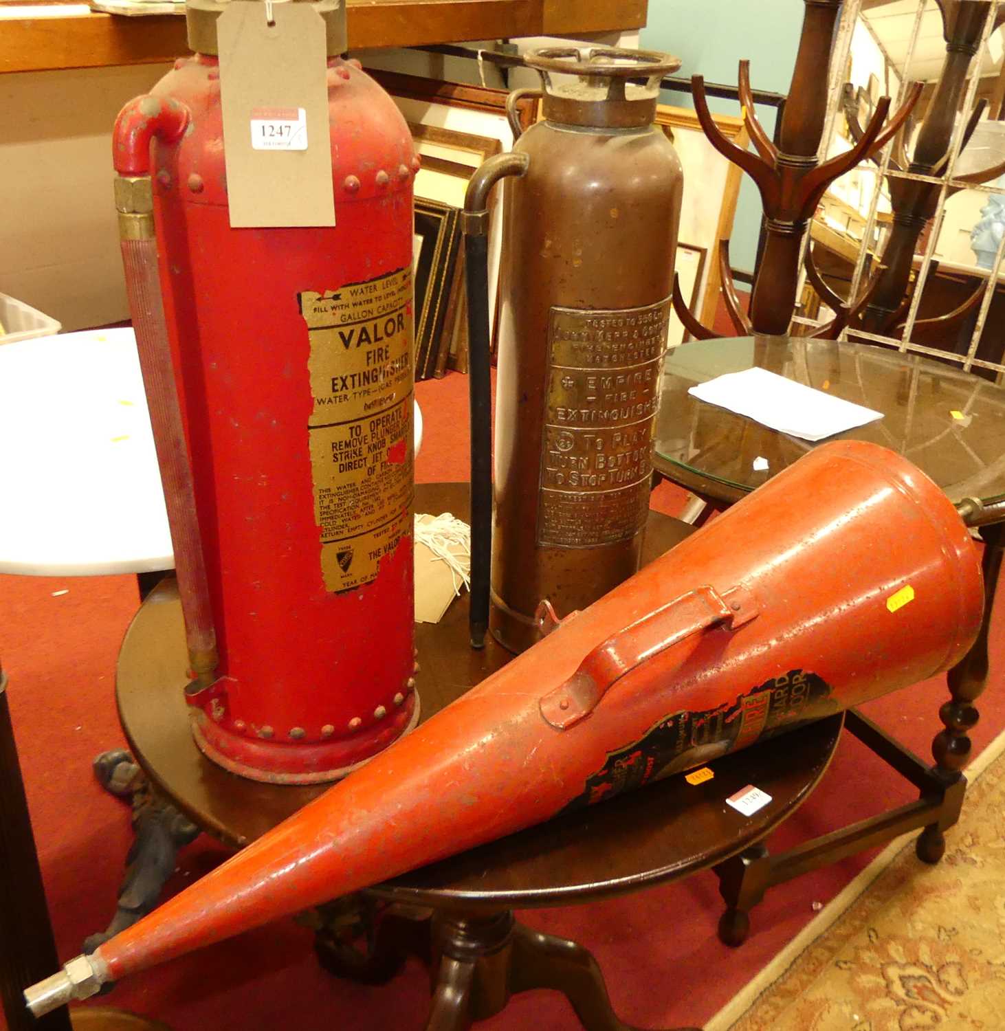 A copper fire extinguisher by The Empire Fire Extinguisher Company, together with a Valor fire