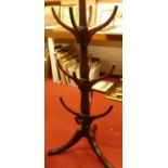 A 19th century mahogany freestanding hall tree, the three tiers each comprised of four shaped hooks,