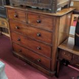 A mid-Victorian mahogany round cornered chest of two short over three long graduated drawers, with