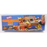 A Hotwheels Stop & Go No. 4100 construction site gift set in the original box Box not sealed, has