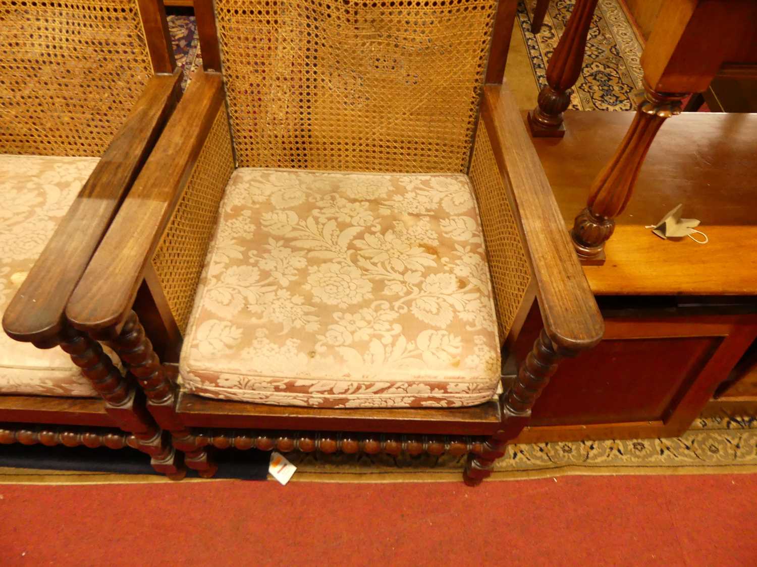 A pair of early 20th century indigenous hardwood and cane bergere chairs, raised on bobbin turned - Image 3 of 6