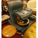 An Ekornes Stressless juniper green leather upholstred swivel reclining armchair, with detachable