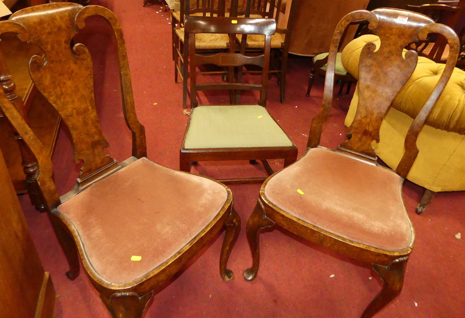 A pair of early 20th century figured walnut splat back dining chairs, in the Queen Anne taste,